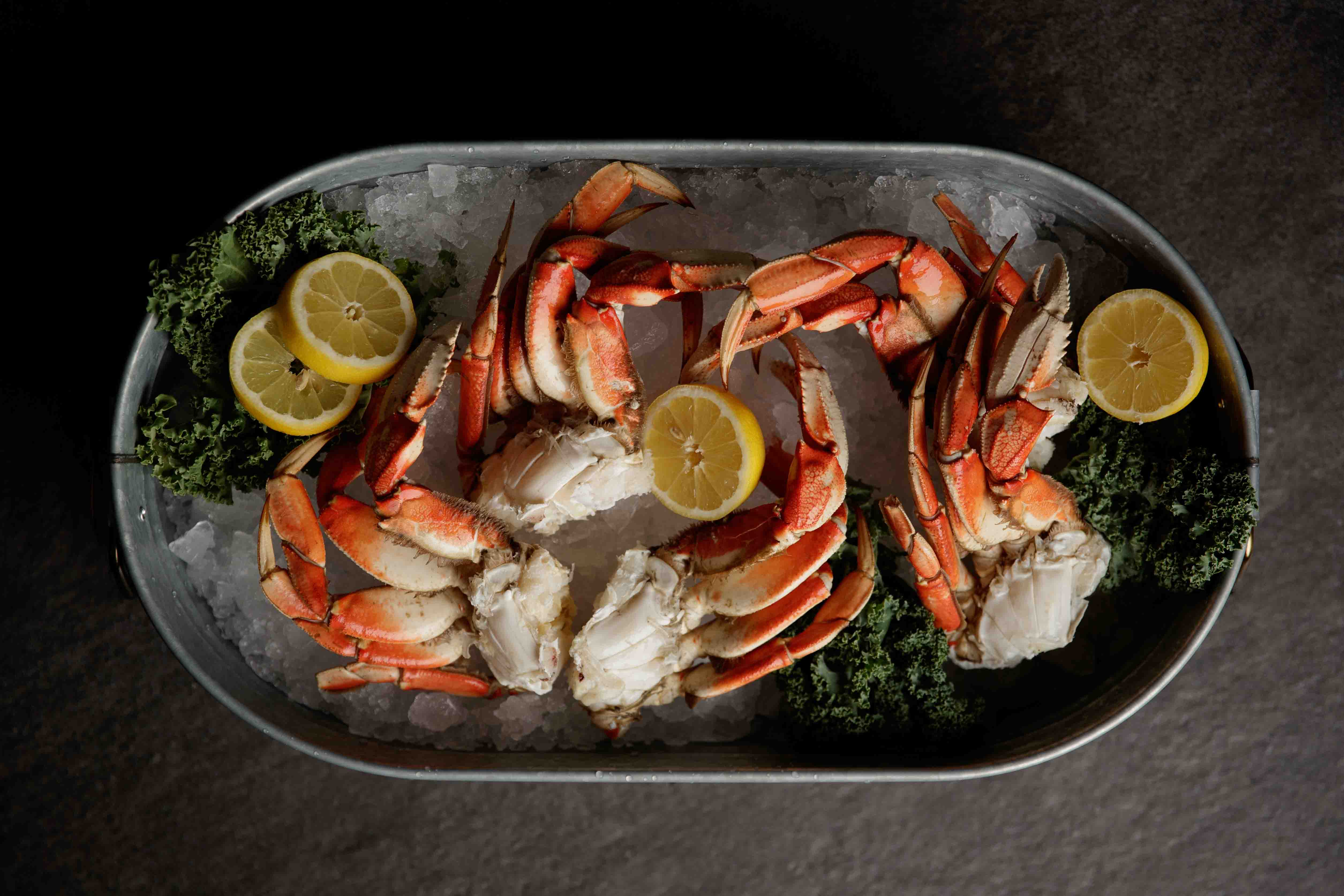 Fresh Dungeness crab and shellfish on ice